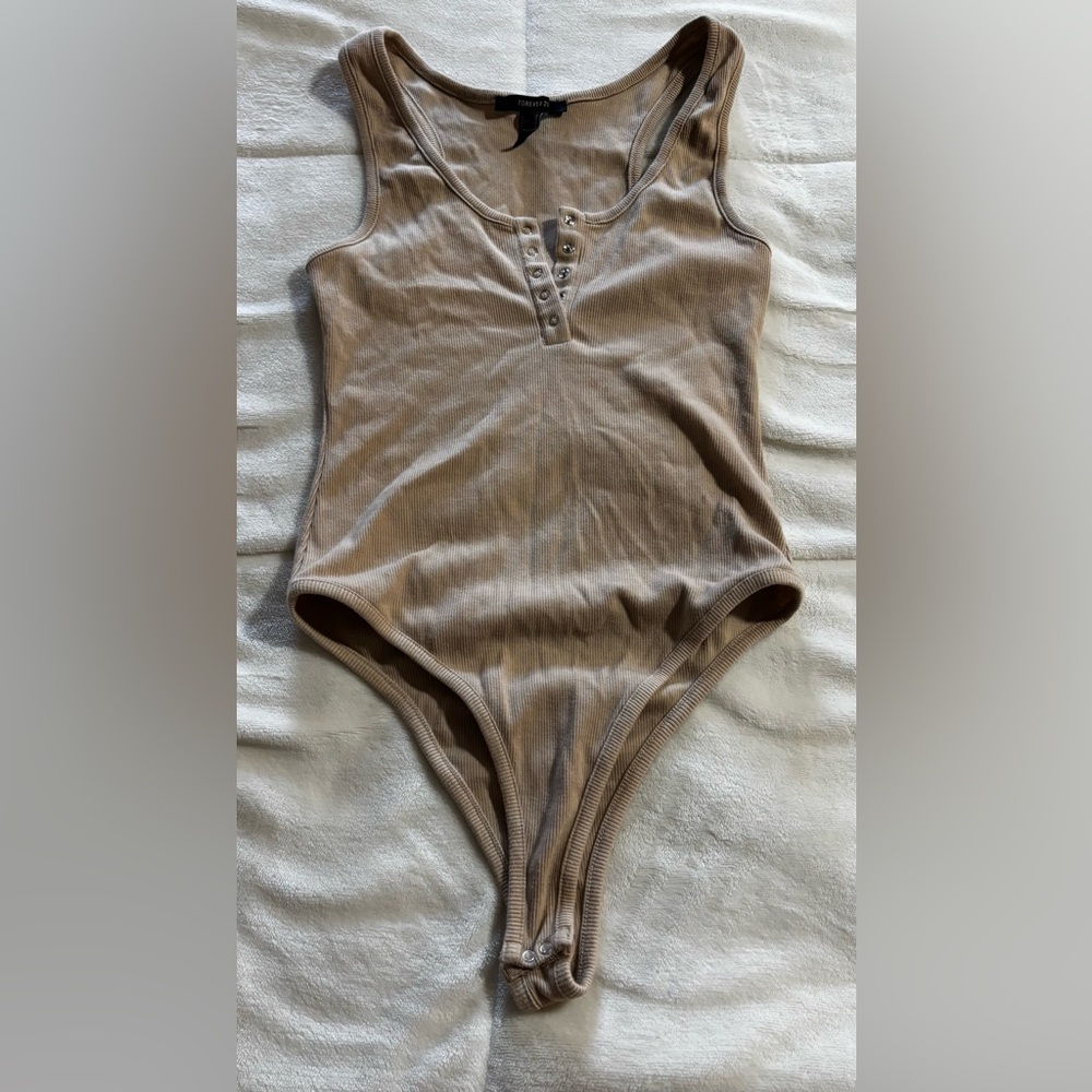 tan button down body suit